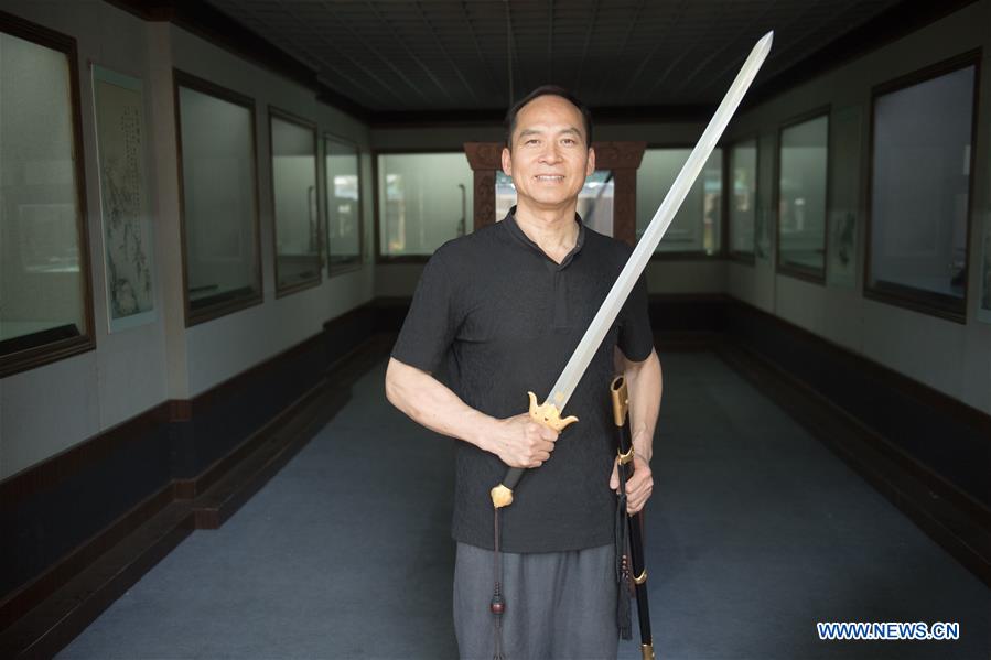 Pic story of intangible cultural heritage inheritor in Longquan Sword making